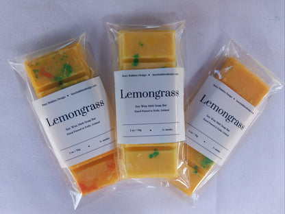 Three packages of lemongrass snap bars on a white background
